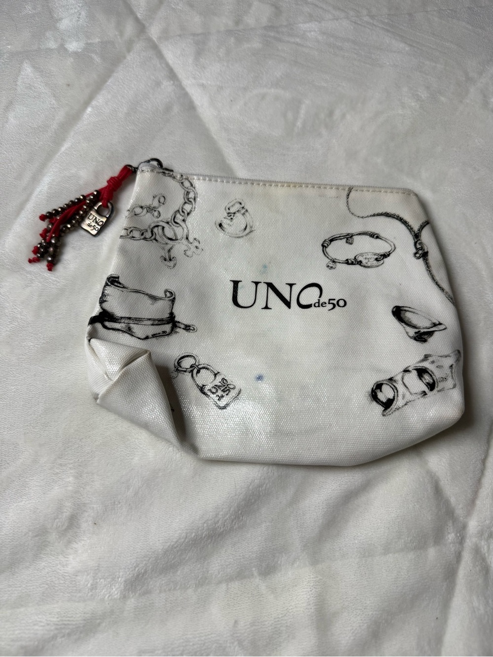 UNOde50 White Canvas Cosmetic Pouch with Red Tassel Charm